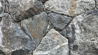 Secrets to creating a beautiful NATURAL STONE WALL Insights from a real stonemason [upl. by Ecirehc]