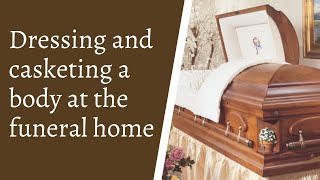 Dressing and casketing a body at the funeral home [upl. by Aerona]